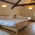 Coach House bedroom with double and single bed